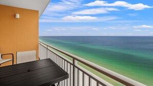 A balcony with a view of the ocean.