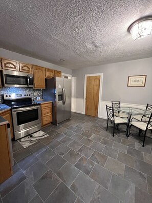 Fridge, microwave, oven, stovetop - Unbelievable penthouse-style apartment in the heart of Elkins, WV. (Elkins)