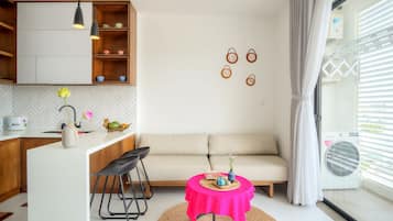Deluxe Apartment, Balcony | Living area | Smart TV