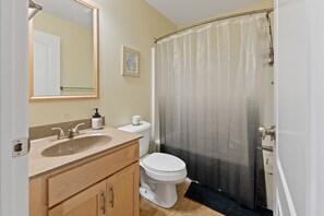 Shower, hair dryer, towels, toilet paper