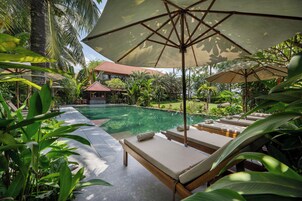 Outdoor pool, open 7:00 AM to 9:00 PM, pool umbrellas, sun loungers