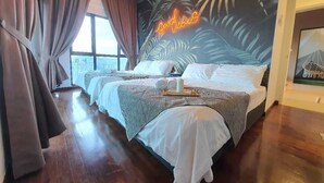 A hotel room with two beds, a large window, and a tropical mural. - Reizz Residence by Plush (Kuala Lumpur)