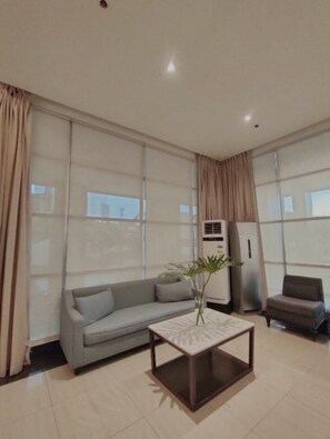 Comfort Condo, 1 Double Bed with Sofa bed, Refrigerator & Microwave, City View | Living area - Centrio Tower Condo Unit (Cagayan de Oro)