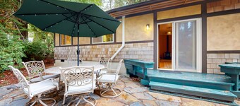 Tree-lined retreat with wood fireplace, board game collection, & pool access