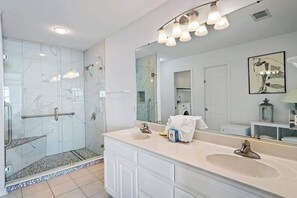 Shower, hair dryer, towels, shampoo