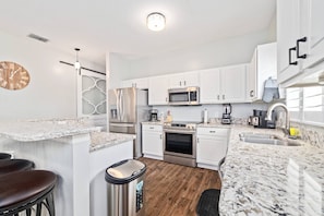 Fridge, microwave, stovetop, dishwasher - Best-Priced Palm Harbor Retreat | Heated Saltwater Pool, Games & Beach Gear Included (Palm Harbor)