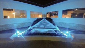 A modern interior with a central staircase, large windows, and a minimalist design. - 1 Deluxe Lifestyle (Sosúa)