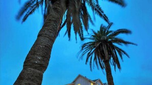 A two-story house with visible windows and a clear sky. - Breakaway by Avantstay Near Music, Eats (Port Aransas)