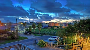 A residential area with houses, a street, and a wooden fence. - Sun Beach by Avantstay Private Pool, Near Beach (Port Aransas)