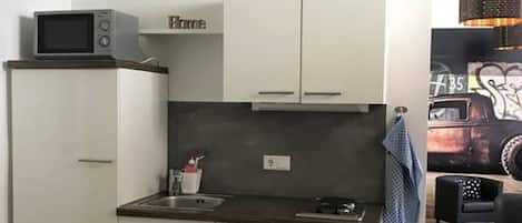 Fridge, microwave, stovetop, coffee/tea maker