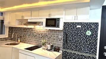 Fridge, electric kettle, cookware/dishes/utensils