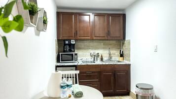 Microwave, stovetop, toaster, dining tables