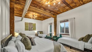 A hotel room with two single beds, a sofa, a chair, and a large window. - Private Estate | Sleeps 35 | 9 Bed 9.5 Bath | 2 Homes | Theater | Pond | Sport Court | Hot Tub | Sauna (Ravenna)