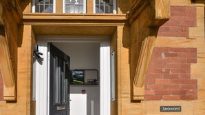 A doorway with a sign reading "Seaward" above it. - Seaward (Lyme Regis)