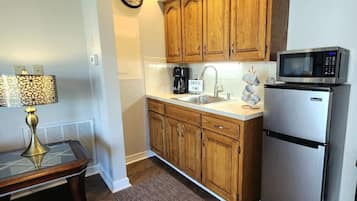 Fridge, microwave, coffee/tea maker, cookware/dishes/utensils