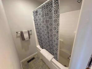 Bathtub, hair dryer, towels