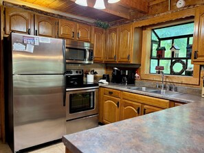 Fridge, microwave, oven, stovetop - Adorable 2BR log cabin w/ games, hot tub, and firepit! (Sevierville)