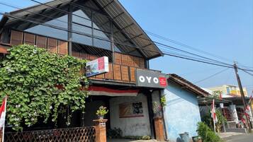 A building with a sign reading "OYO" and a large window.