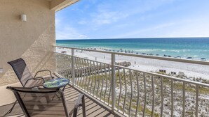 A balcony with a view of a beach and ocean. - Crystal Sands 314A - Gulf Front, Free Beach Service, Heated Pool, Sleeps 8 (Destin)