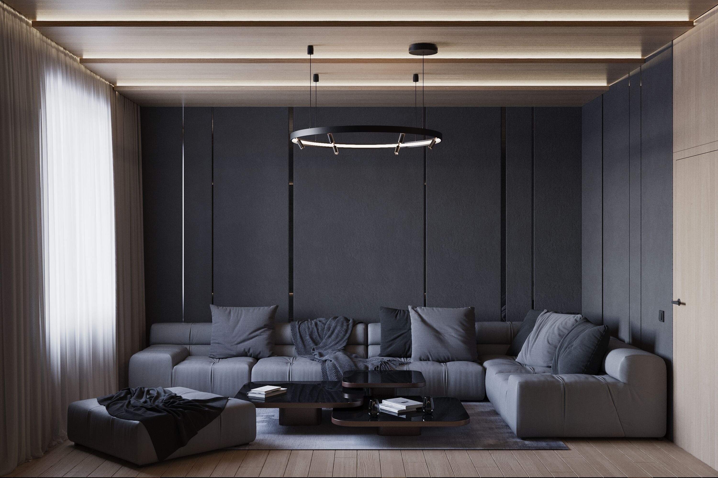 A modern living room with a sectional sofa, two coffee tables, and a pendant light.