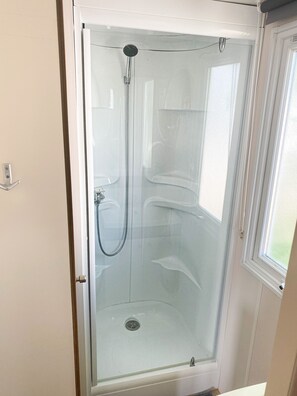 Shower, towels, toilet paper