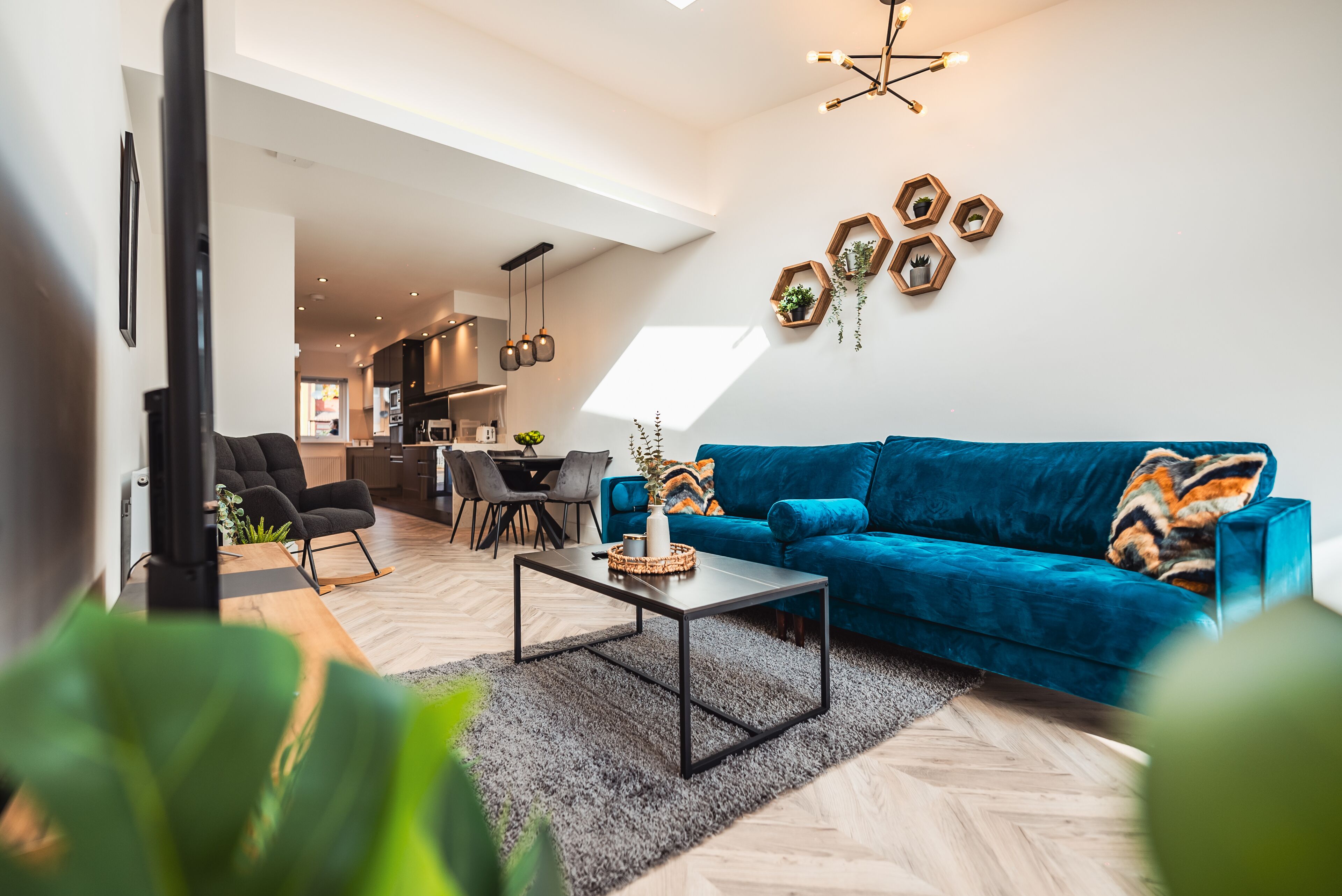 Deluxe House | Living area | 65-inch Smart TV with digital channels