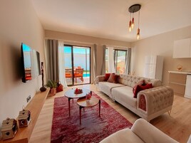 Vila família | Área de estar | TV de tela plana