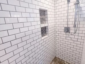 Shower, hair dryer, towels, toilet paper