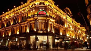 A historic building with ornate architecture and a prominent sign for 'Galerias Pacifico'. - obelisco hoteles (Buenos Aires)