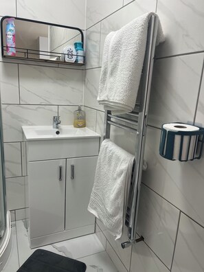Eco-friendly toiletries, hair dryer, towels, soap