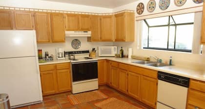 Experience true desert living in this classic Tucson ranch in the Tanque Verde Valley