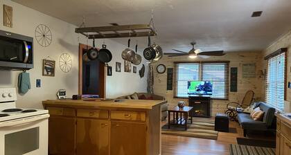 Rustic home on wooded lot, very private. Lake and dock access. Close to trails.