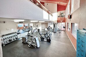 A multi-level gym with various exercise equipment, including treadmills and dumbbells. - Condo 1236 at Ventana Vista (Tucson)