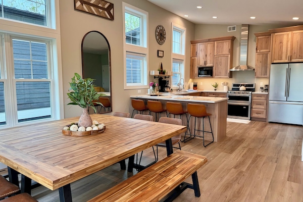 The large, Modern, and gorgeous dining and kitchen area has everything you need.