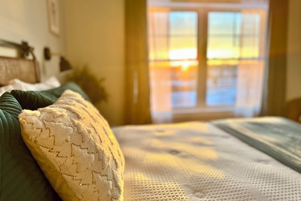 Primary Bedroom with amazing sunrise views directly to Saint Louis River.