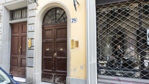 A building with two brown doors, numbered 77 and 79, and a metal gate. - Serragli Retreat in Florence by Mmega (Firenze)
