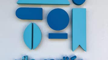 A logo with geometric shapes and the text "vilcarijos" on a plain background.