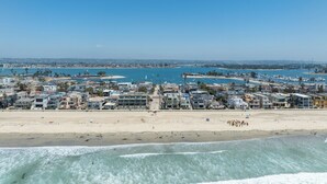 A coastal town with a beach, marina, and residential buildings. - Oceanfront | Private Ground Floor Patio | Hot Tub (San Diego)