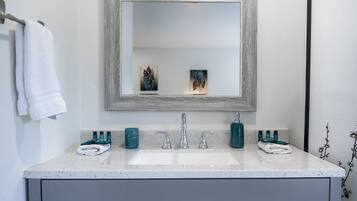 Combined shower/tub, hair dryer, towels, toilet paper