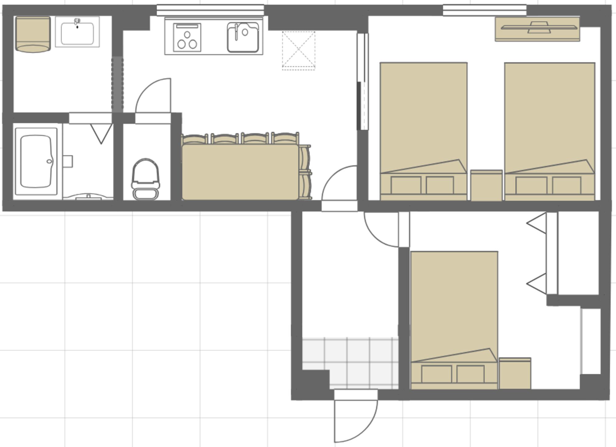 A floor plan with a kitchen, two bedrooms, a bathroom, and a living area.