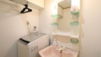 Hair dryer, towels, soap, shampoo