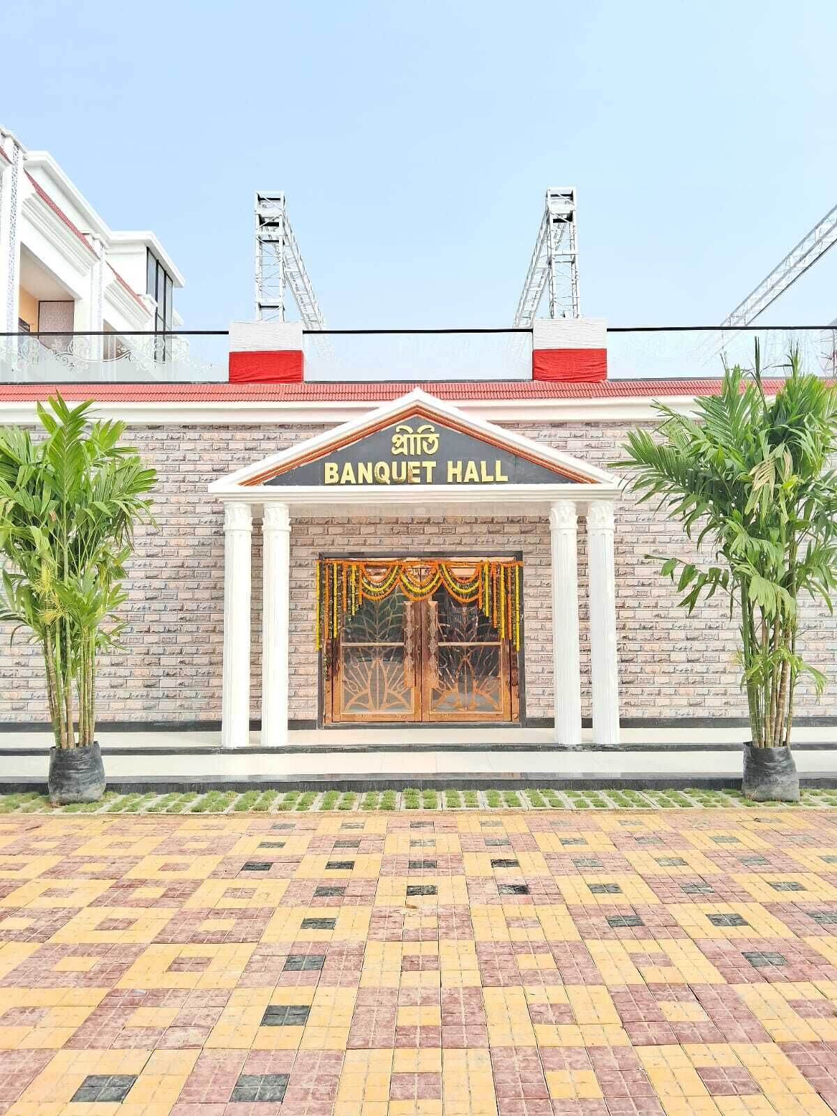 A building with a sign reading "BANQUET HALL" and a brick facade.