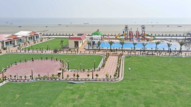 A resort with a pool, water park, and beach view. - Prime beach resort  Mandarmani (Kanthi)