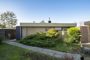 Stylish home with a flat roof, garden, and outdoor space.