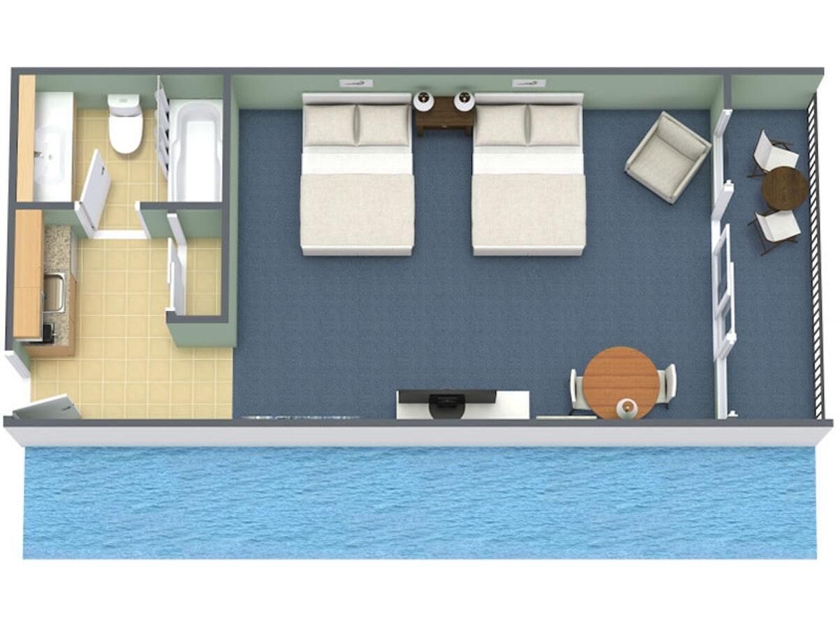 Un bote con baño, dos camas, una pequeña cocina y zona de comedor.