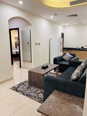 Superior Suite | Ruang tamu | TV skrin rata 