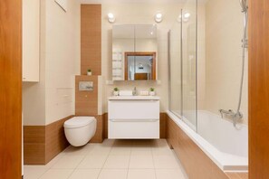 Bathtub, hair dryer, shampoo