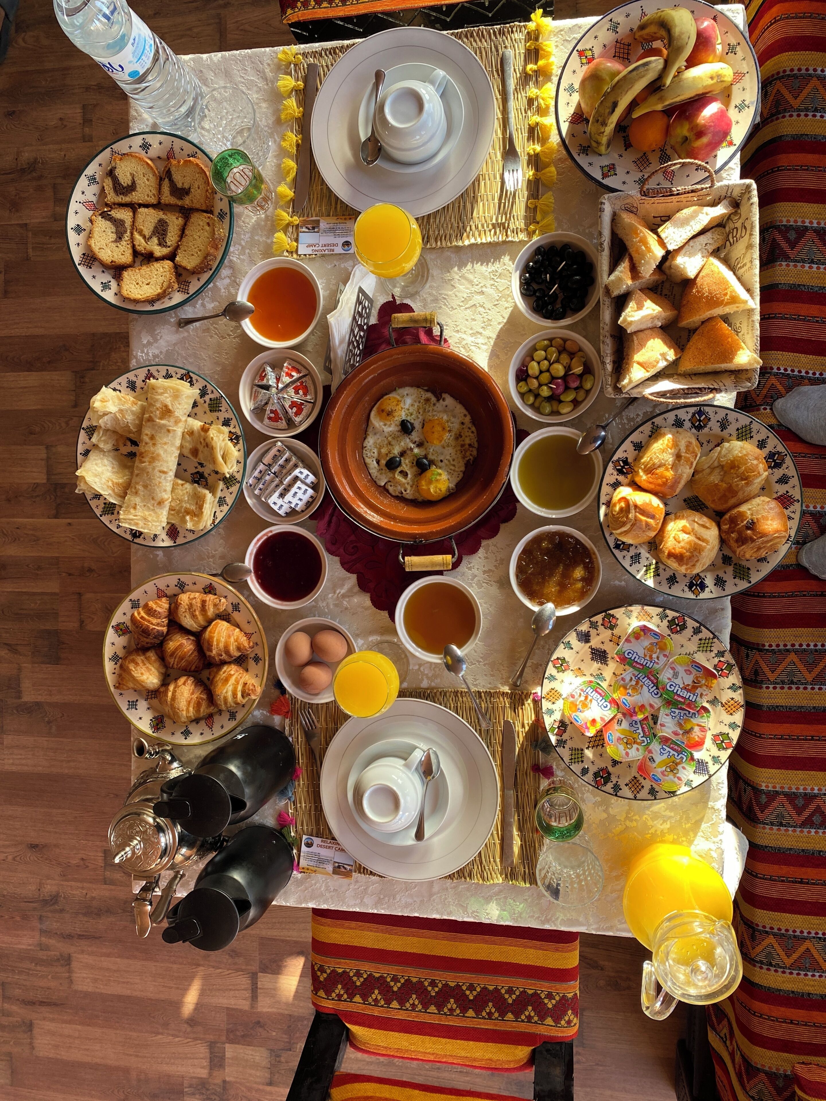 A breakfast buffet with various food items and beverages.