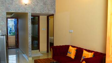 1 BHK Service Apartment | Living area | 45-inch Smart TV with digital channels