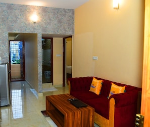 Appartement Premium (1 BHK Service) | Coin séjour